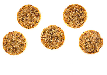 round kozinaki of sunflower seeds isolated on white background. copy space. flatlay.