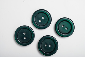 old plastic buttons in different colors on the background.