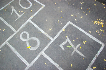 Close-up hopscotch kid game drawn on pavement