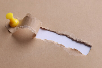 Inscription search in hole on white paper with ragged edges