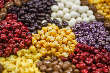 Sweets in bulk, chocolate and in a multi-colored glaze