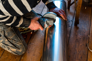Installation of a pipe for a flue from stainless steel, a pipe with a diameter of two hundred millimeters.