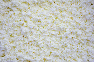 Cottage cheese is shot in close-up on the whole frame