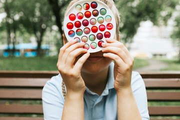 colorful trendy antistress sensory toy fidget push pop it and simple dimple in kid's hands on...