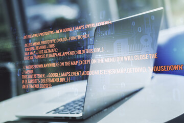Double exposure of abstract programming language on laptop background, research and development concept