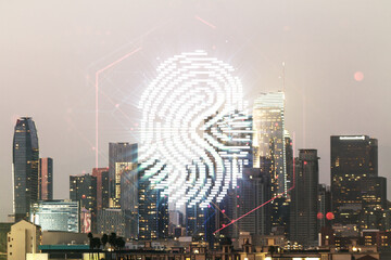 Multi exposure of virtual fingerprint scan interface on Los Angeles office buildings background, digital access concept