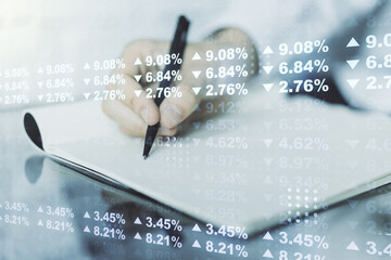 Multi exposure of stats data illustration with man hand writing in notebook on background, computing and analytics concept