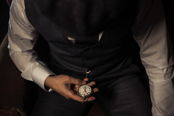 close up of a person holding 
old watch