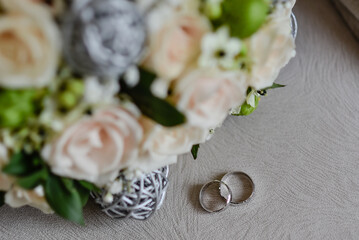 two rings on a plate with flowers