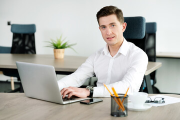 Businessman, manager in office with laptop