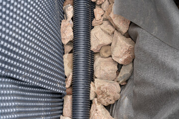 Building rainwater drainage with help of a plastic pipes.