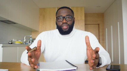 African american businessman talking to camera making conference business call