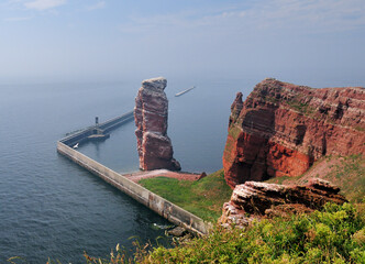 View To The Famous Rusty Sea Stack Lange Anna Of The North Sea Island Helgoland On A Sunny Summer Day With A Clear Blue Sky And A Few Clouds