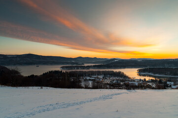 The January sunrise over Lake Solina seen from the viewpoint in Polańczyk. Polanczyk, Bieszczady Mountains.