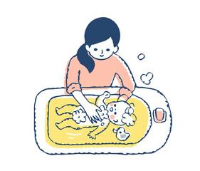 赤ちゃんをお風呂に入れるママ