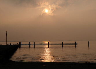 Fototapeta na wymiar Late Afternoon Sun Reflecting On The Dollart Bay At The North Sea Coast Near Emden East Frisia On A Sunny Autumn Day