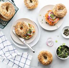 Everything bagels with cream cheese and salmon lox, ready for eating.