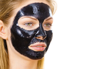 Girl black carbo peel off mask on face