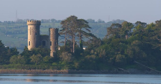 Fairytale legend castle two towers turrets and forest river moat