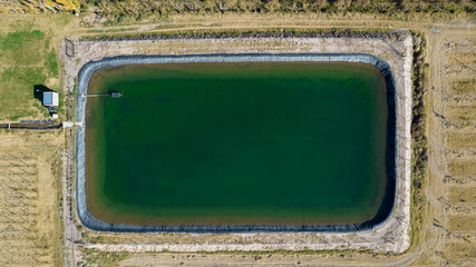 Aerial view of a water tank (pool) for irrigation in agriculture.