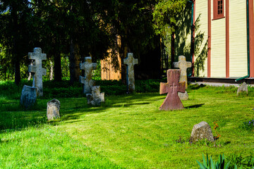 Old stone crosses at the ancient cemetery. Abandoned graveyard