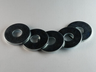 High angle shot of flat washers on a white surface