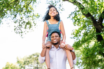 Fototapeta premium Father and daughter having fun together outdoors.