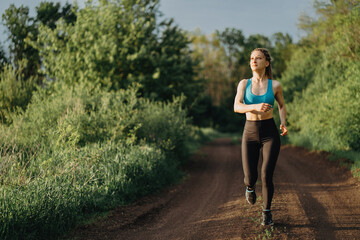 Active woman jogging in the countryside. Sport