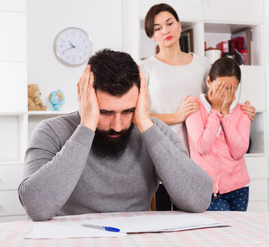 Young Family Having Difficulties With Paying Utility Bills And Rent. High Quality Photo