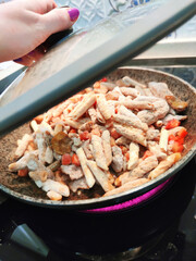 Tyrolean pork penne rigate feather pasta frozen food pan photo