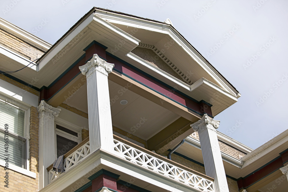 Sticker Shot of the last floor of the house with white columns.