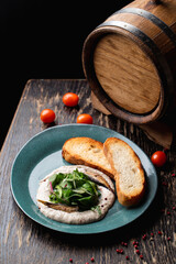 Gourmet fish spat on a restaurant black wooden table, magazine photo