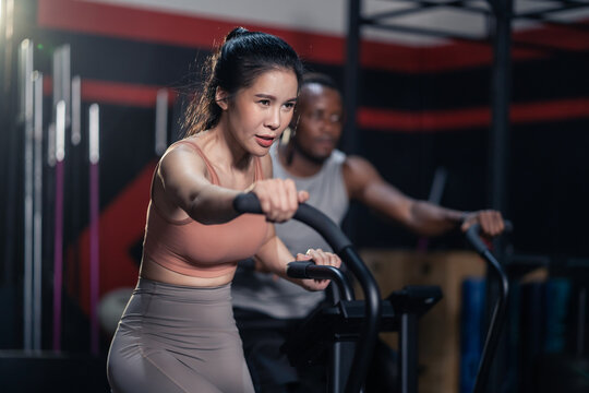 Fitness Trainer Girl Use Bike Exercise To Workout At Fitness Stadium