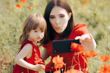 Mother and Daughter Taking Selfies in a Poppy Field 