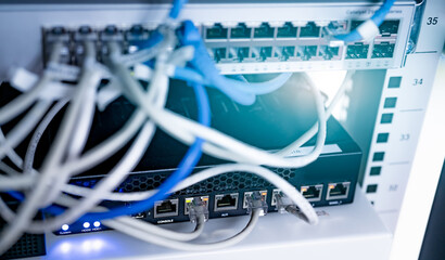 Network switch and ethernet cable in data center. Wifi plug of internet router for computer....