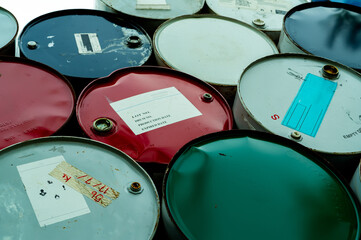 Old chemical barrels. Blue, green, and red oil drum. Steel oil tank. Toxic waste warehouse. Hazard...