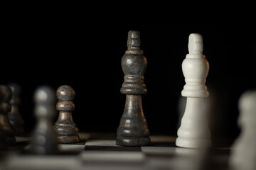 Close up of chess pieces on a chess board.