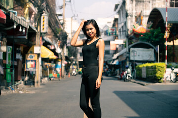 Fototapeta premium Female feels happy to walk street outdoor for shopping