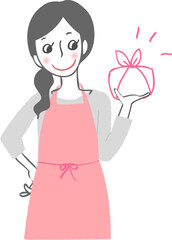 お弁当を持つエプロン姿の女性。