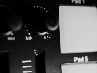 Closeup shot of music equalizer equipment on a keyboard