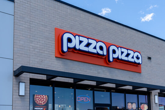 Whitchurch-Stouffville, On, Canada - May 30, 2021: Close-up of Pizza Pizza sign on the building, a franchised Canadian pizza quick-service restaurant.