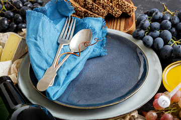 Empty serving blue plate with fork spoon in frame of food ingredients Mediterranean Kitchen...