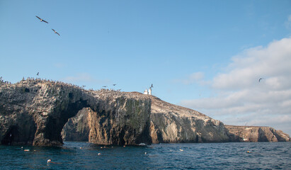 Fototapeta na wymiar Anacapa Island arch rock formation and lighthouse in the Channel Islands National Park offshore from the Ventura area of southern California USA