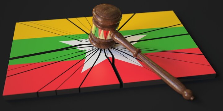Block with flag of Myanmar hit by judge's gavel. Court related 3d rendering