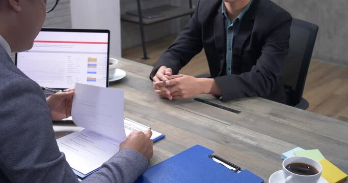 Job HR applicants having an interview with Human resource manager jobs interviewing with confident candidate at business firm office give cv resume. Job Interview with headhunter agent and applicant