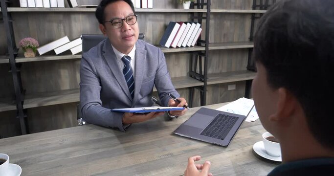 Job HR applicants having an interview with Human resource manager jobs interviewing with confident candidate at business firm office give cv resume. Job Interview with headhunter agent and applicant