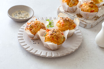 Homemade cheesy, tomato and zucchini muffins close up