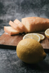 Lemon pound cake with slices of lemon sugar icing. Delicious breakfast, traditional tea time treat. Reciepe of English lemon pie loaf.
