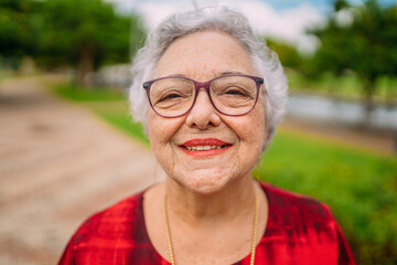 Joyful senior lady in glasses laughing. Latin American woman. Brazilian elderly woman.