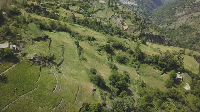 Aerial view of Las Alpujarras with terraced hills in Granada, Spain.